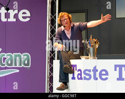 Picture By: Nick Cunard / Retna Pictures - Hugh Fearnley-Whittingstall speaking in the Taste Theatre at Taste of London Food and Drink Festival at Regents Park in London. 19th June 2009.  70386  NCD - Non-Exclusive Stock Photo
