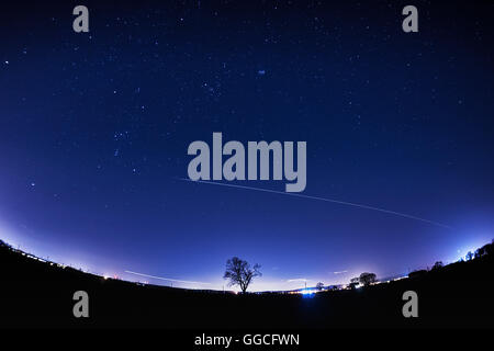 International Space Station (ISS) fly past in a clear starry sky Stock Photo