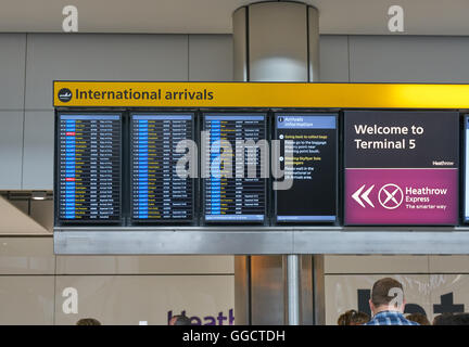 arrivals board at airport,  heathrow arrivals,  airplane arrivals terminal 5 Stock Photo