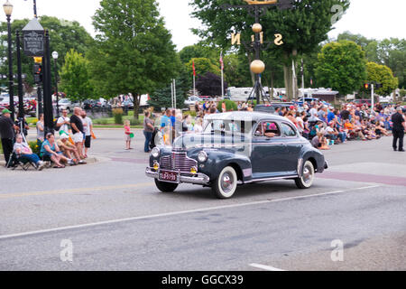 1941 Dodge sedan rolls in the 2016 Annual Cruz In parade in downtown Montague, Michigan. Stock Photo