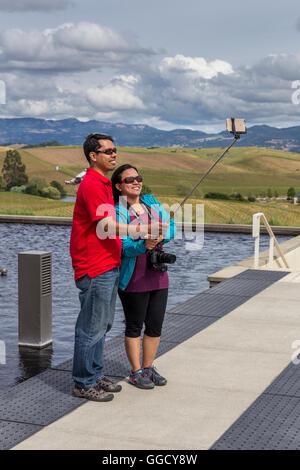 tourists, couple, posing for selfie photo, taking selfie, selfie photo, Artesa Vineyards and Winery, Carneros region, Napa Valley, California Stock Photo