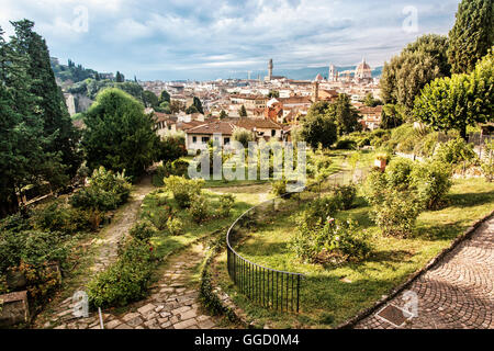 View from Giardino delle Rose to the city of Florence. Tuscany, Italy. Travelling scene. Beauty photo filter. Greenery and town. Stock Photo