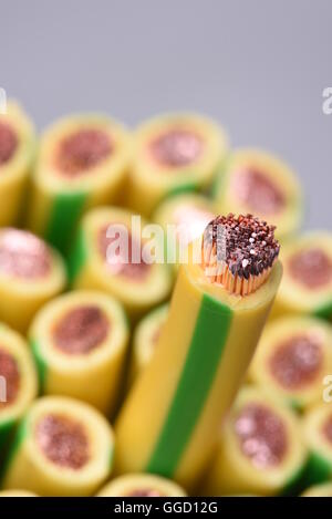 Group of yellow and green earth cables and selective focus on one closeup Stock Photo