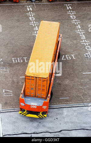 Unmanned Automated Guided Vehicle with a container in the Port of Rotterdam Stock Photo