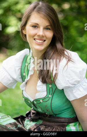 portrait of beautiful young woman wearing a bavarian dirndl Stock Photo