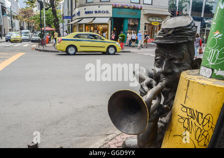 A Bossa Nova bronze statue of a man playing the saxophone in Ipanema, Rio de Janeiro, Brazil. Rio de Janeiro is famous for its annual carnival parade Stock Photo