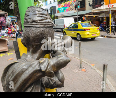 A Bossa Nova bronze statue of a man playing the saxophone in Ipanema, Rio de Janeiro, Brazil. Rio de Janeiro is famous for its annual carnival parade Stock Photo