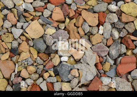 Broken tiles from torn down building serves as temporary road pavement. Stock Photo