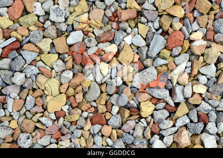 Broken tiles from torn down building serves as temporary road pavement. Stock Photo