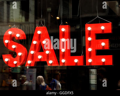 Big red sale sign with lights in shop window in shopping precinct of Belgrade capital of Serbia Stock Photo