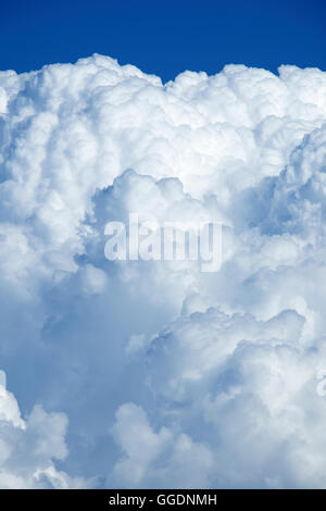 Aerial view of puffy cumulus clouds and deep blue sky taken from high altitude balloon Stock Photo