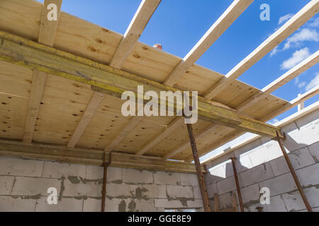 Construction workers placing formwork Stock Photo