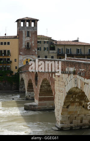 The Ponte Pietra known as the Pons Marmoreus, is a Roman arch bridge crossing the Adige River in Verona, Italy. Stock Photo