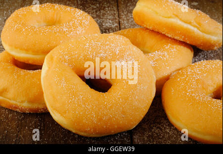 Donuts on wooden background Stock Photo