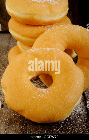 Donuts on wooden background Stock Photo