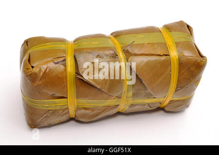 Vietnamese Cylindrical Sticky Rice Cake or Banh Tet on a white background Stock Photo