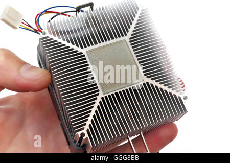 Computer CPU Heatsink And Thermal Paste In Hand Stock Photo
