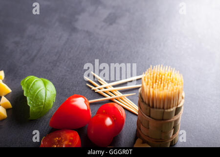 Marinated fillet with tomato heart shaped.  Appetizer for a party. Valentine's Day treat for your loved one. Stock Photo