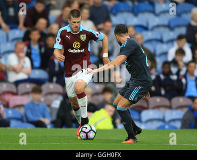 Burnley's Johann Berg Gudmundsson (left) and Real Sociedad's Hector Hernandez Ortega battle for the ball during the pre-season friendly match at Turf Moor, Burnley. Stock Photo