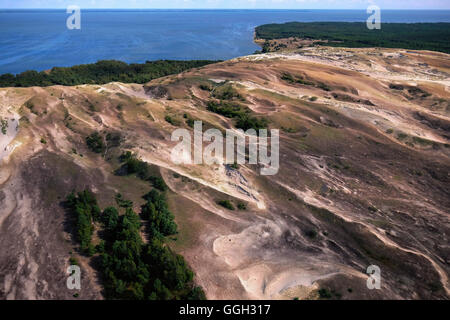 Aerial view of a strip of moving dunes on the Lagoon side between Juodkrante and Pervalkaon the Curonian Spit a 98 km long, thin, curved sand-dune spit that separates the Curonian Lagoon from the Baltic Sea coast in Lithuania Stock Photo