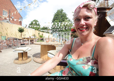 Kay Riley, co-owner of 'Rileys & Co'; in the outdoor area of her eclectic vintage shop in the Antiques Quarter, Sheffield, UK Stock Photo