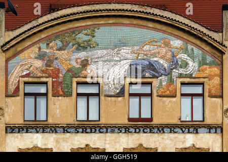 Allegory of Music. Allegorical mosaic designed by Czech artist Karel Ludvik Klusacek on the House of the Hlahol Choir Society in Prague, Czech Republic. The House of the Hlahol Choir Society designed by Czech architects Frantisek Schlaffer and Josef Fanta was built in 1902-1905 in Masarykovo Embankment. Stock Photo