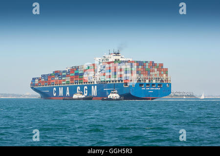 The Giant CMA CGM Centaurus New Panamax Container Ship Is Manoeuvred Into The Long Beach Container Terminal, California, USA. Stock Photo