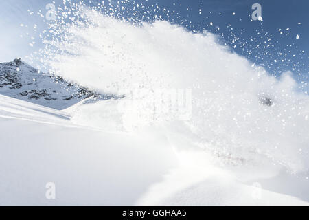 Winter sports athlete doing a turn in the deep powder snow, Pitztal, Tyrol, Austria Stock Photo