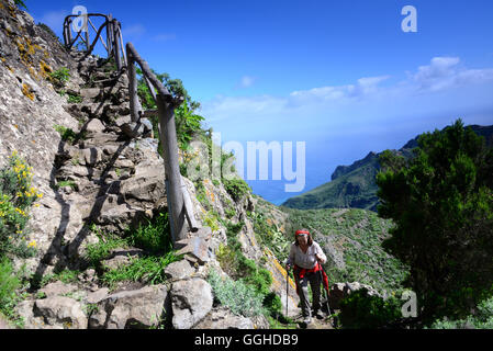 Woman hiking uphill, Macizo de Anaga mountain range, Chamorga, Tenerife, Canary Islands, Spain