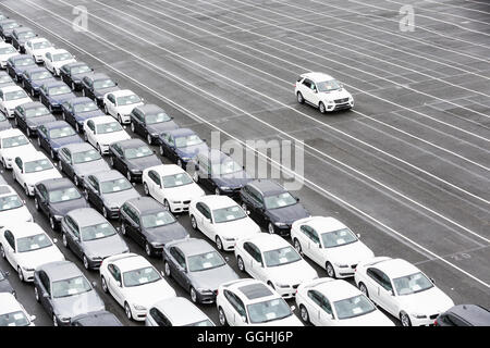 New cars on a parking area awaiting shipping in Bremerhaven, Germany Stock Photo