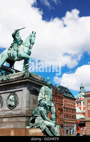 King Gustav Adolf II. at Gustaf-Adolf-Torg, with the steeple of Jacob's church in the background, Stockholm, Sweden Stock Photo