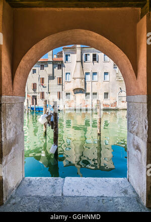 Chioggia glimpse from the arcades along the canals. Stock Photo