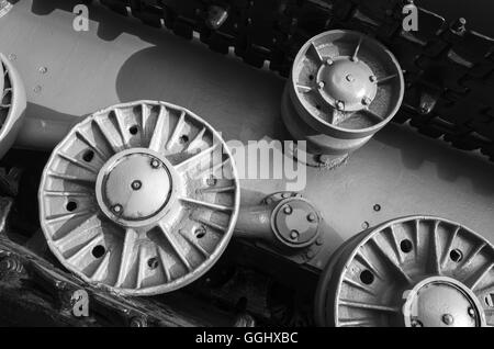 Tank wheels and caterpillar. Closeup black and white photo, heavy industry details Stock Photo