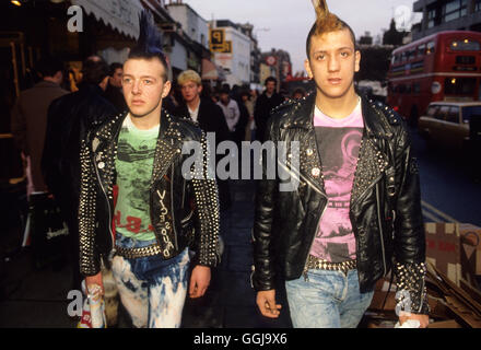 1980s punk fashion punks fashions Kings Road Chelsea London UK Teens making a fashion statement, studded jackets, punk hairstyle,  home bleached out jeans. 1985 HOMER SYKES Stock Photo