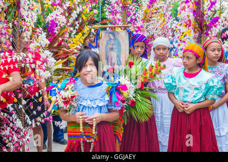 Salvadorian people participate in the procession of the Flower & Palm Festival in Panchimalco, El Salvador Stock Photo