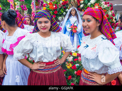 Salvadorian people participate in the procession of the Flower & Palm Festival in Panchimalco, El Salvador Stock Photo