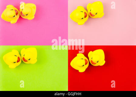 Photo Collage of Pair of yellow rubber ducks isolated over colorful background, love concept Stock Photo