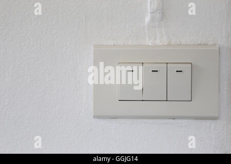 light switch on wall in the house,device plugs for open and close. Stock Photo