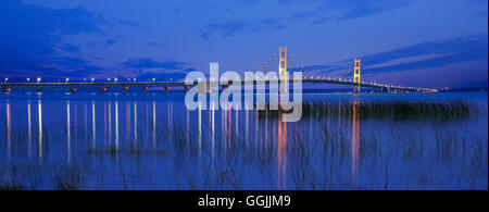 Seen From St Ignace in the upper peninsula at dusk, the Mackinac Bridge spans the upper and lower peninsulas of Michigan, USA Stock Photo