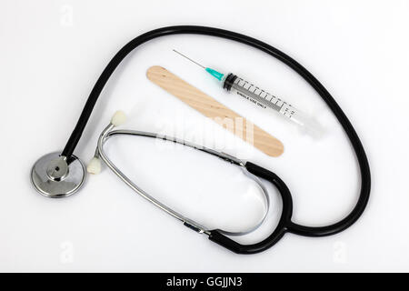 stethoscope and medical syringe with white background Stock Photo