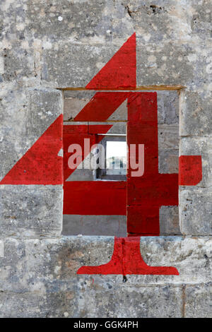 Red number four at a house wall, Noto, Syracuse, Sicily, Italy Stock Photo