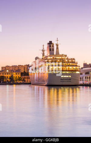 Cruise ship MS Deutschland (Reederei Peter Deilmann) at Malaga Cruise Terminal at dusk, Malaga, Andalusia, Spain Stock Photo