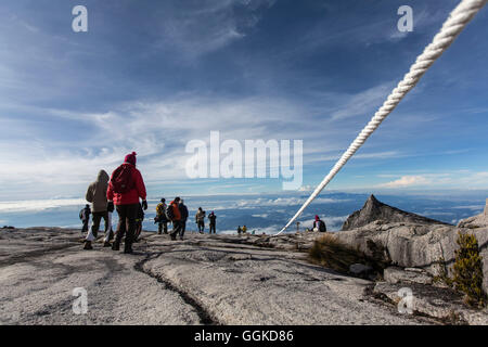 Mountain Tourists climbing down from the Low's Peak 4091 m, Mount Kinabalu, Borneo, Malaysia Stock Photo