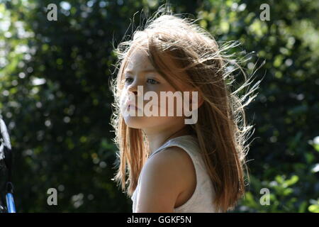 Little girl with sun shining in her hair