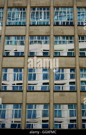 Peter House windows reflect the newer office building KPMG's One St Peter's Square Stock Photo