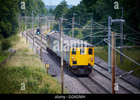 West Coast Main Line passenger train    locomotives livery diesel class 37 passenger local heading north of Preston track railwa Stock Photo