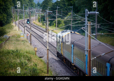 West Coast Main Line passenger train    locomotives livery diesel class 37 passenger local heading north of Preston track railwa Stock Photo