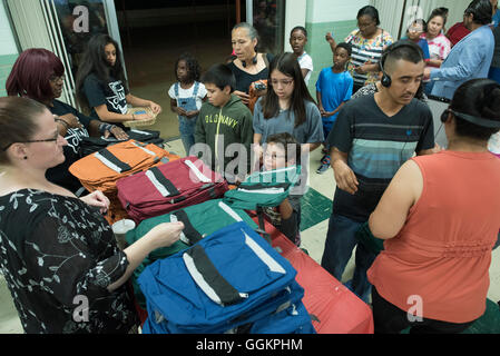Kids and parents get  free school supplies and backpacks at Colorin Colorado summer program for English language learners Stock Photo
