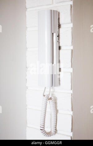 Close-up of the apartment intercom on the brick wall Stock Photo