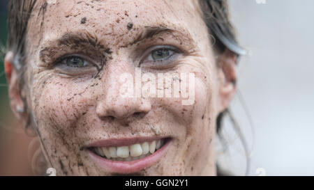 Woellnau, Germany. 06th Aug, 2016. Miriam Vohla from TuS Leutzsch, a participant in the German Championship in Mud Soccer, poses after a match in Woellnau, Germany, 06 August 2016. The winners of the playful championship qualify for the World Championship in Finland. Photo: ALEXANDER PRAUTZSCH/dpa/Alamy Live News Stock Photo